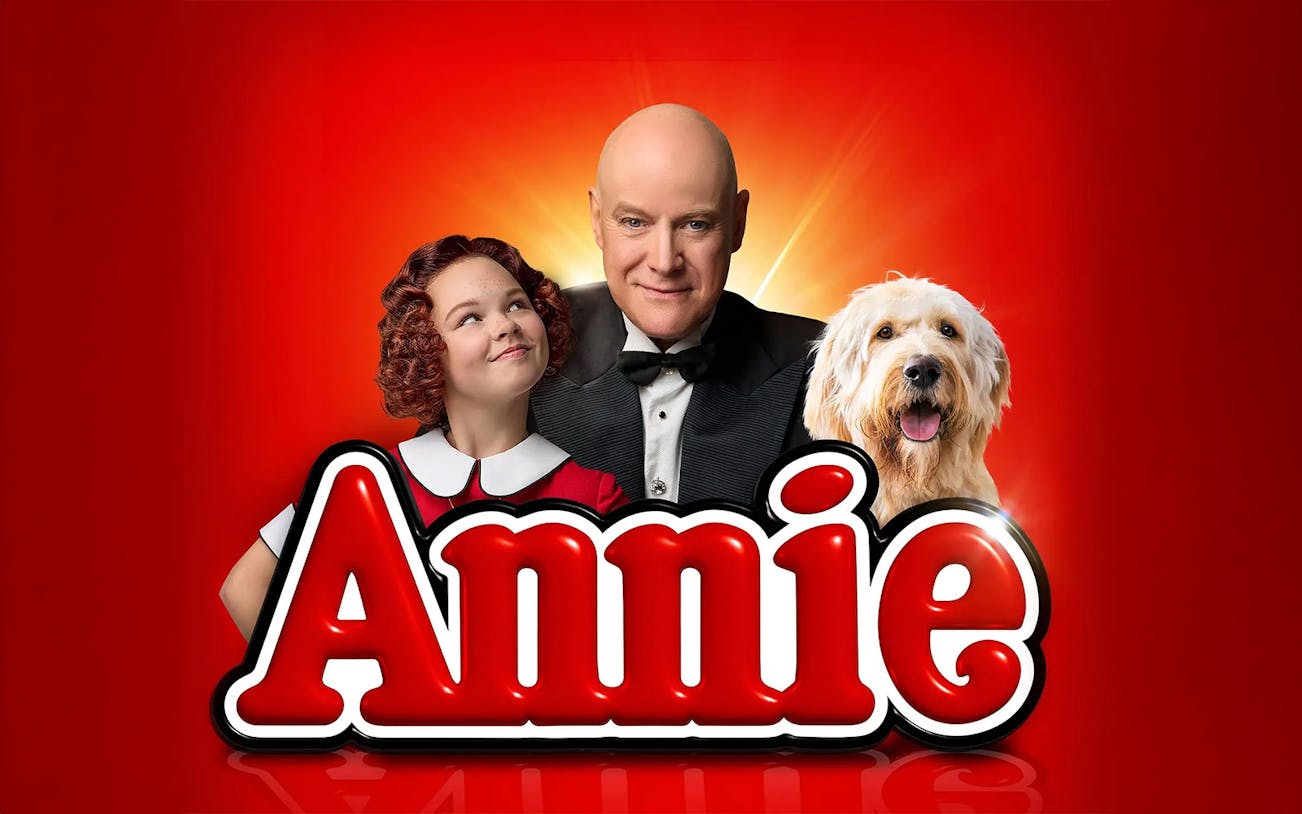 Annie musical poster with characters and dog, Brisbane.