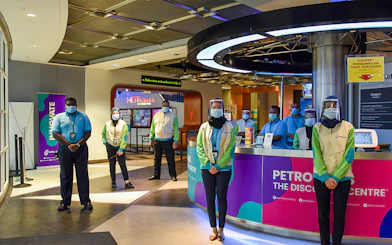 Petrosains staff at the entrance, Kuala Lumpur, part of Combo: Petrosains + Aquaria KLCC tour.