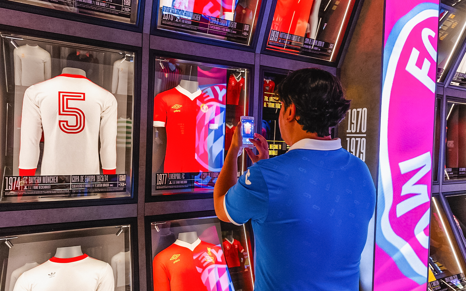Football memorabilia display at Legends: The Home of Football Museum, featuring iconic jerseys and trophies.