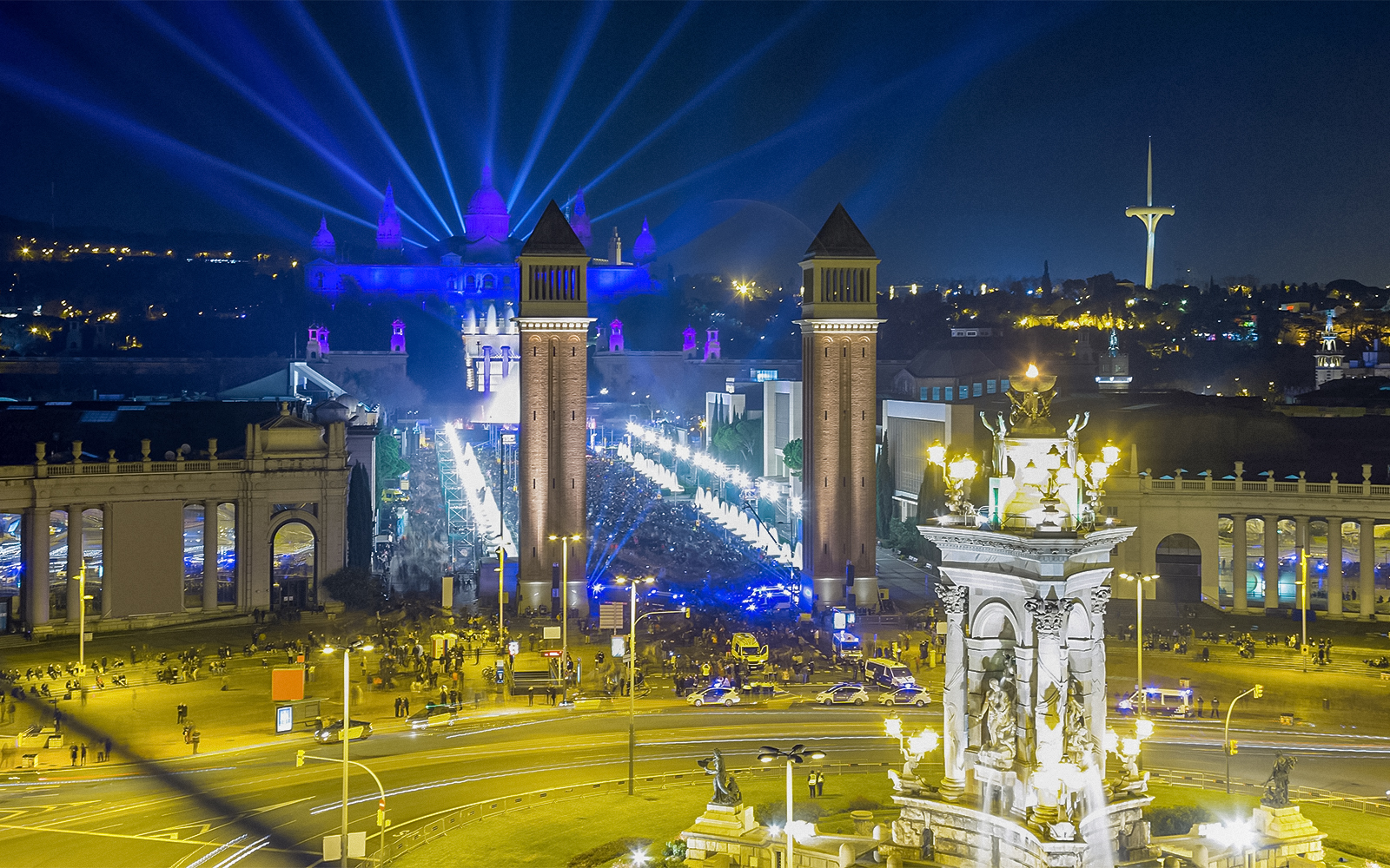 Fireworks illuminate the night sky over Placa Espana, Barcelona, during New Year celebrations.