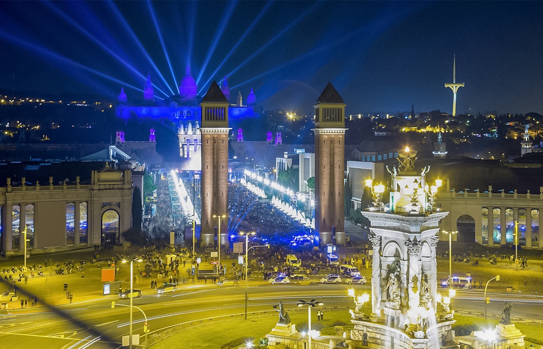 Fireworks illuminate the night sky over Placa Espana, Barcelona, during New Year celebrations.