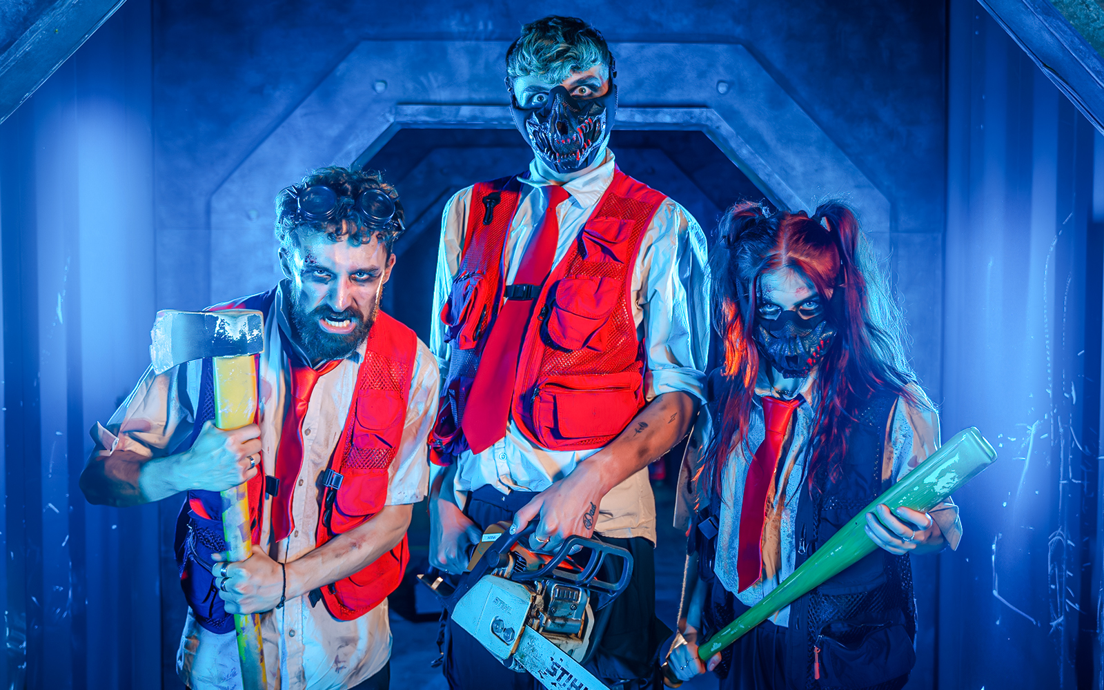 Actors in Halloween costumes with props at Thorpe Park event.