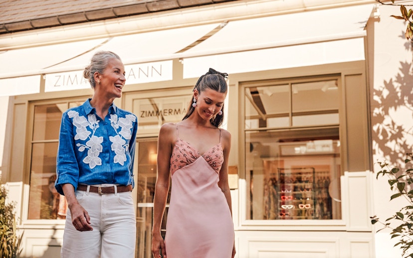 Couple shopping at La Vallée Village, Paris, France.
