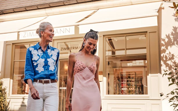 Couple shopping at La Vallée Village, Paris, France.