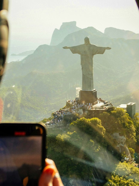 Helicopter view of Christ the Redeemer statue in Rio de Janeiro.