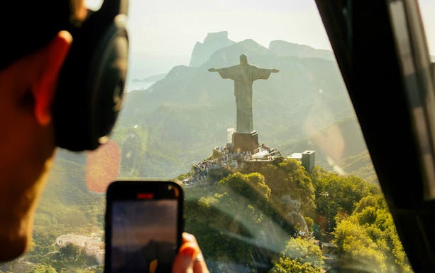 Helicopter view of Christ the Redeemer statue in Rio de Janeiro.