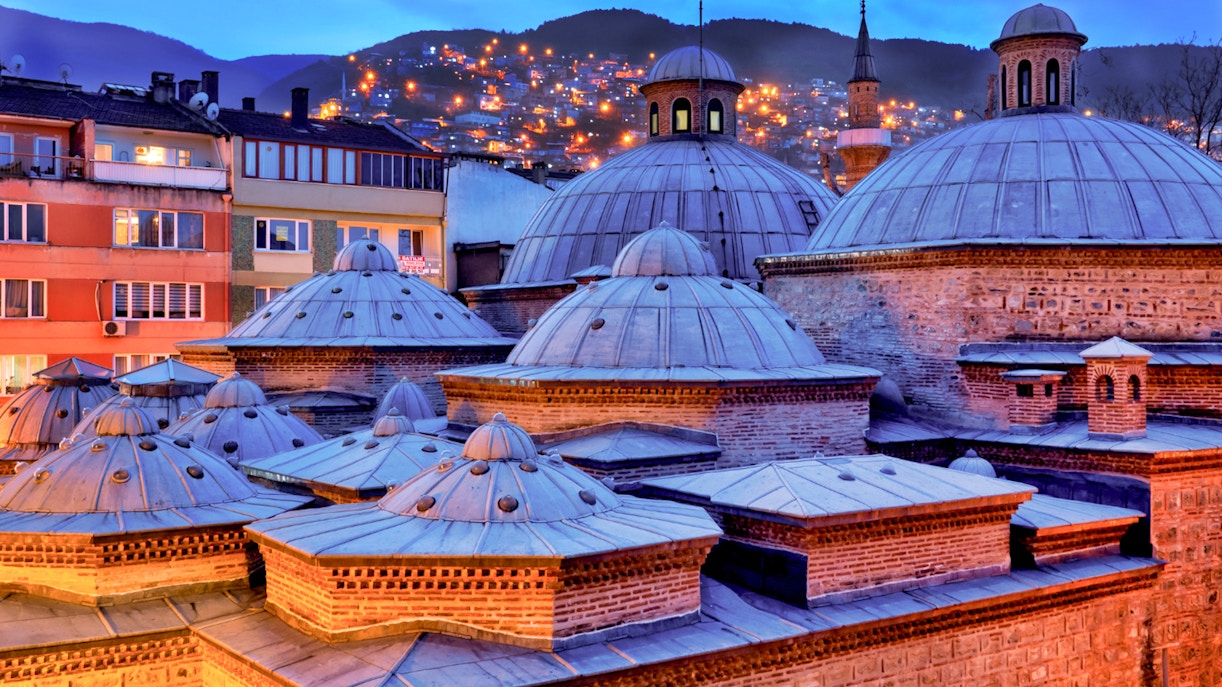 Bodrum Turkish Bath and Spa exterior at evening with illuminated entrance and traditional architecture.