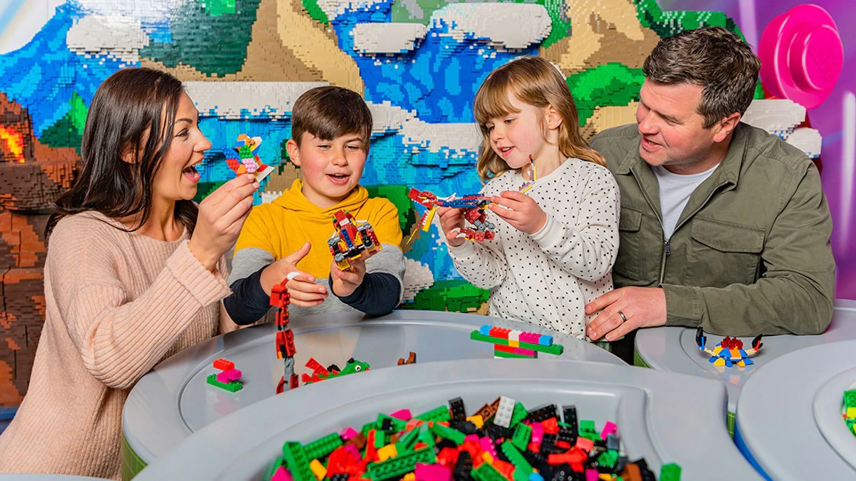 Guests building with LEGO bricks at Legoland Windsor.