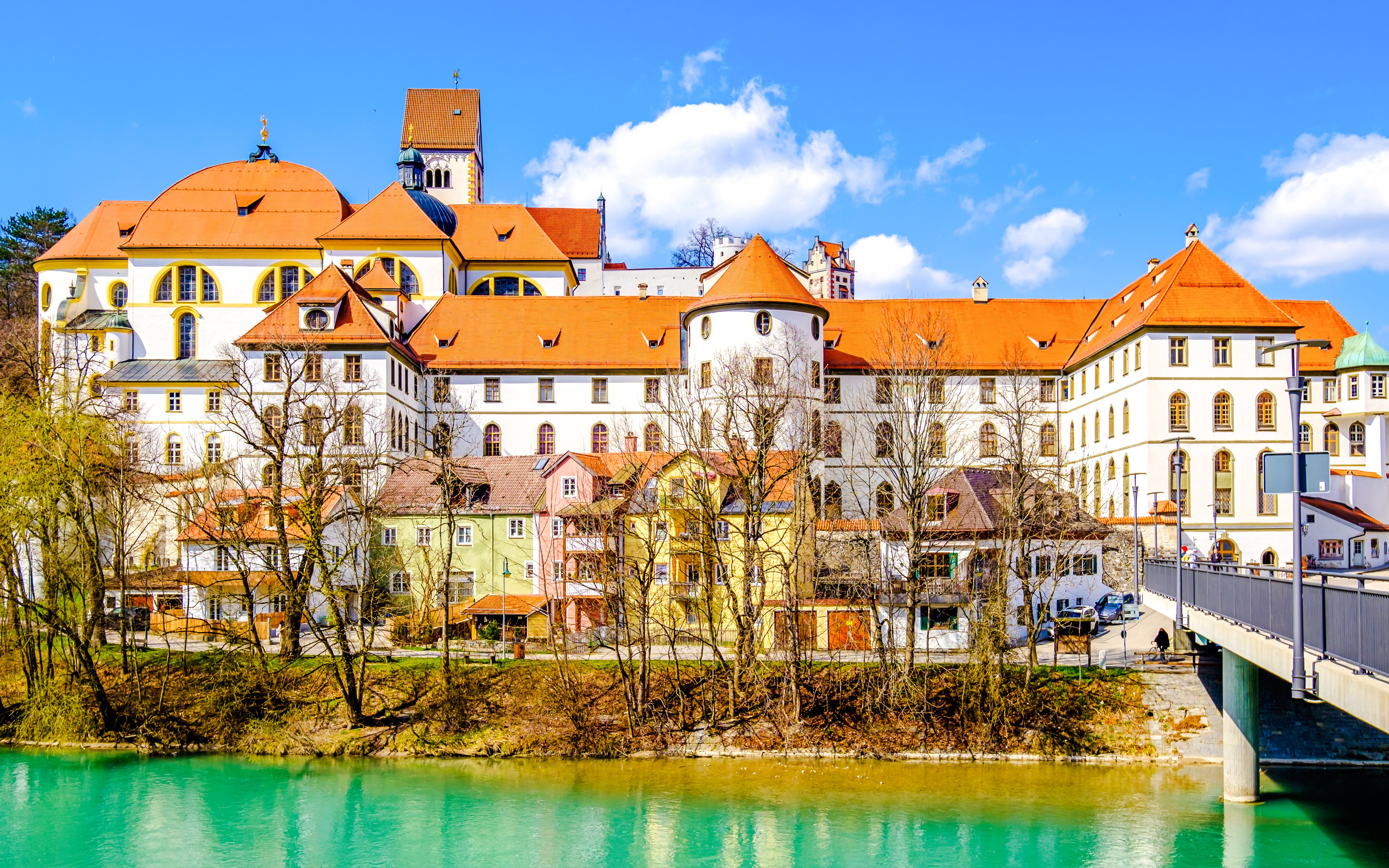Füssen Old Town with colorful buildings and river view.