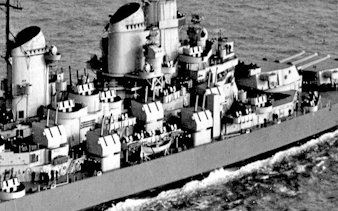 Battleship IOWA on the ocean, showcasing its deck and turrets during a guided tour experience.
