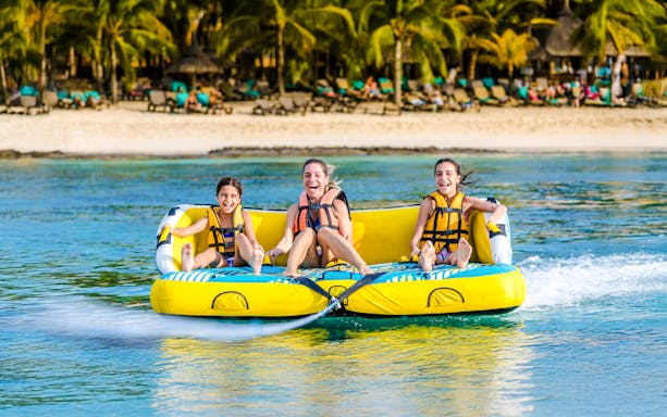 Women enjoying a water donut ride in Dubai.