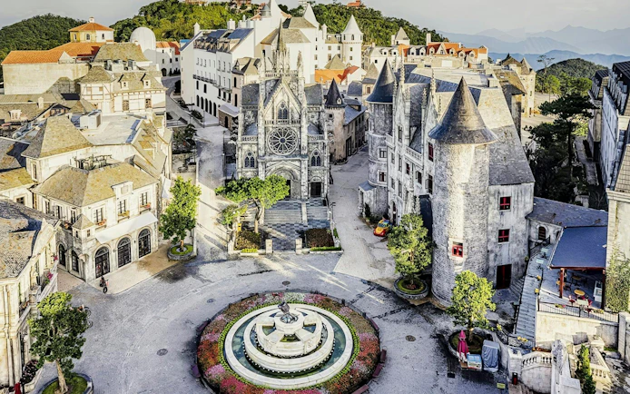 European-style architecture and central fountain at French Village, Sun World Ba Na Hills, Da Nang.