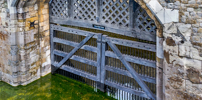 Traitors Gate at the Tower of London, England, with water beneath.