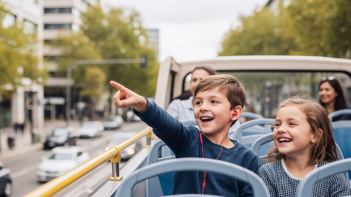 Children enjoying a city tour on a hop-on hop-off bus.