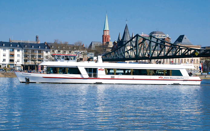 Cruise ship on the Main River with Frankfurt skyline in the background.