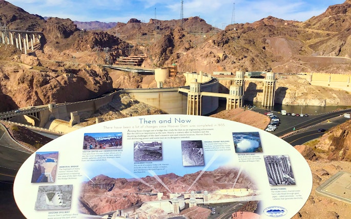 Hoover Dam with informational display and surrounding landscape on exploration tour.