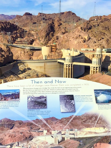 Hoover Dam with informational display and surrounding landscape on exploration tour.