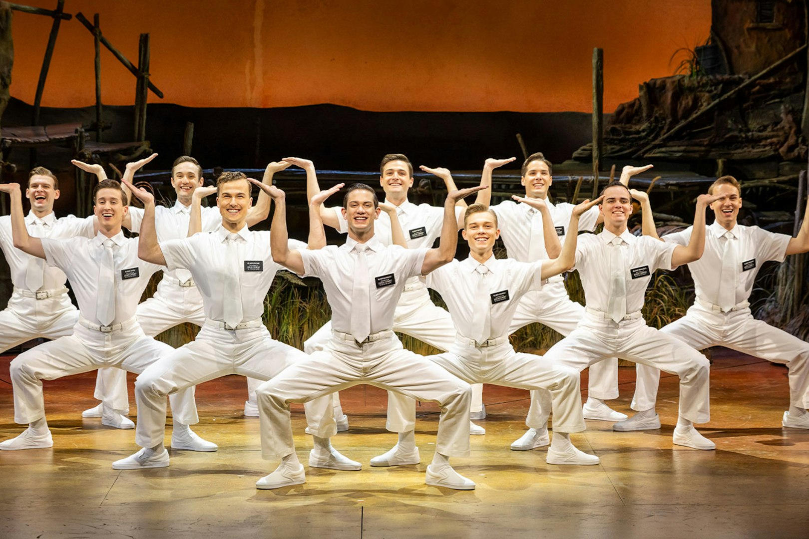 Cast performing The Book of Mormon on stage in Sydney.