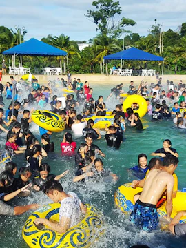 Visitors enjoying the wave pool at Wonderland Water Theme Park.