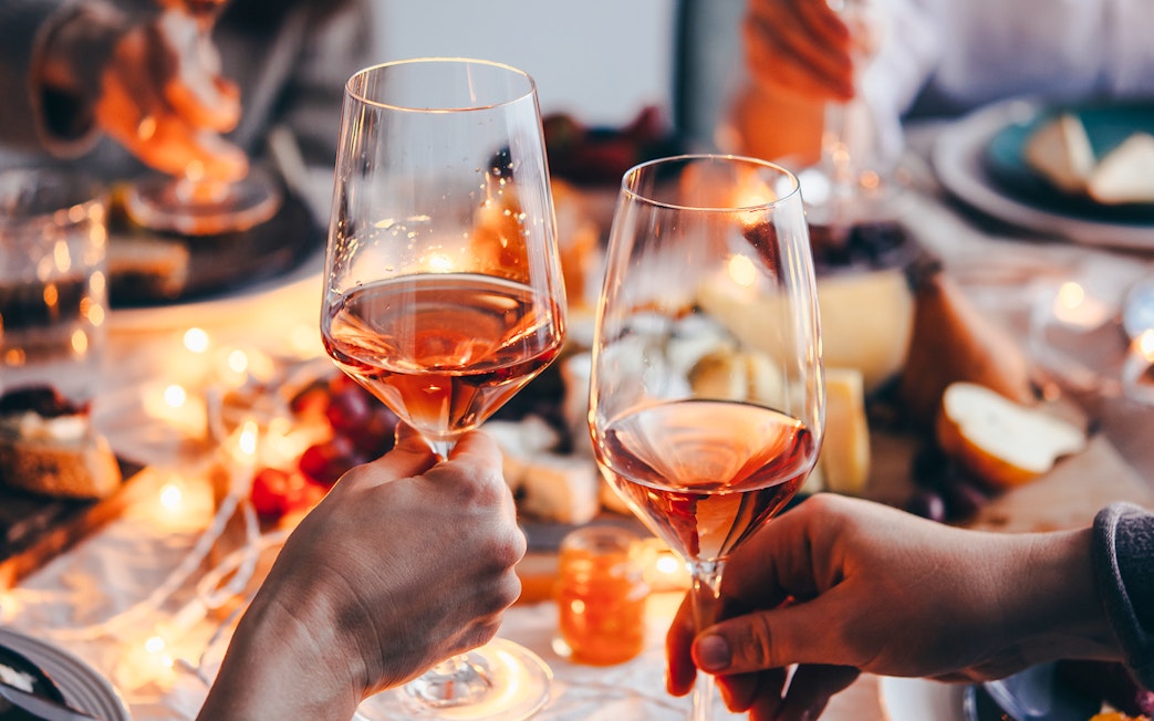 Clinking wine glasses at Cheese Museum in Paris.