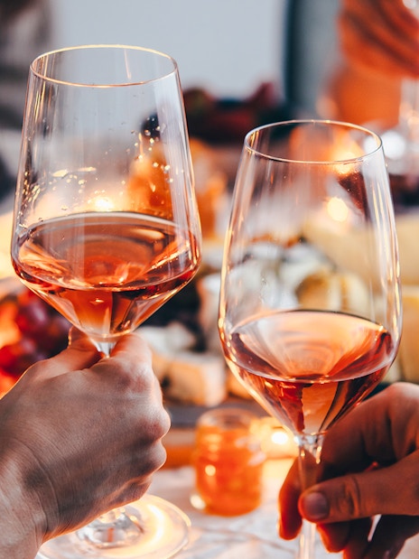 Clinking wine glasses at Cheese Museum in Paris.