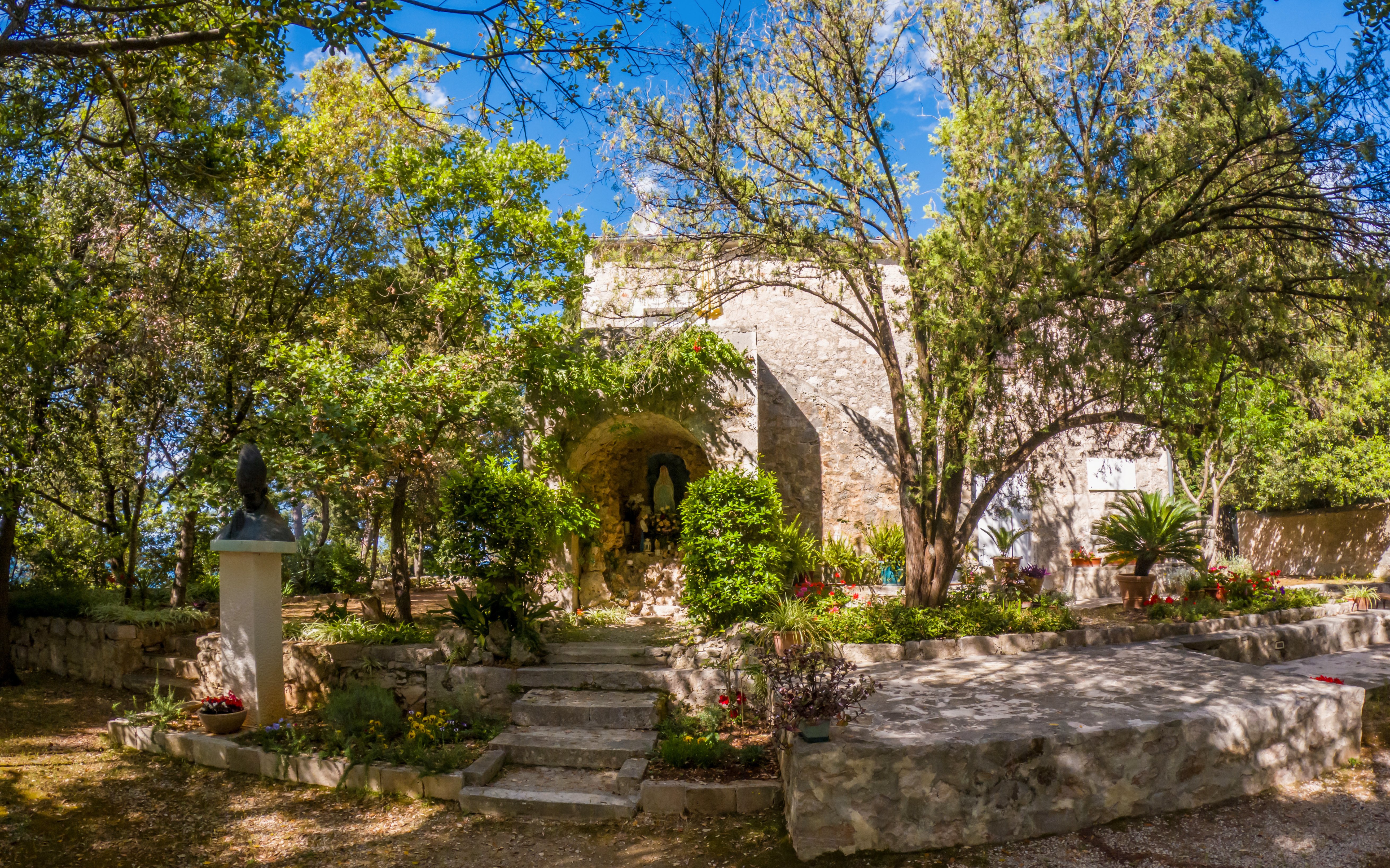 Monastery surrounded by trees on Galevac Island, Croatia.