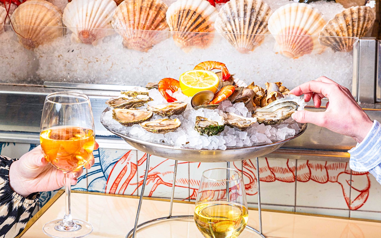 Seafood platter with oysters and shrimp at Opéra-Grand Café Capucines, Paris.