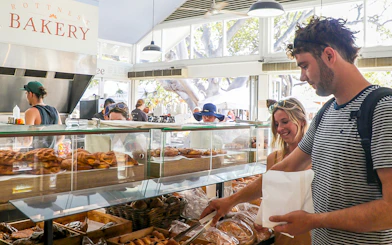 Customers selecting pastries at Rottnest Island bakery.