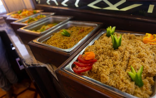 Buffet with rice and noodles on yacht, Orange Bay Island, Hurghada.