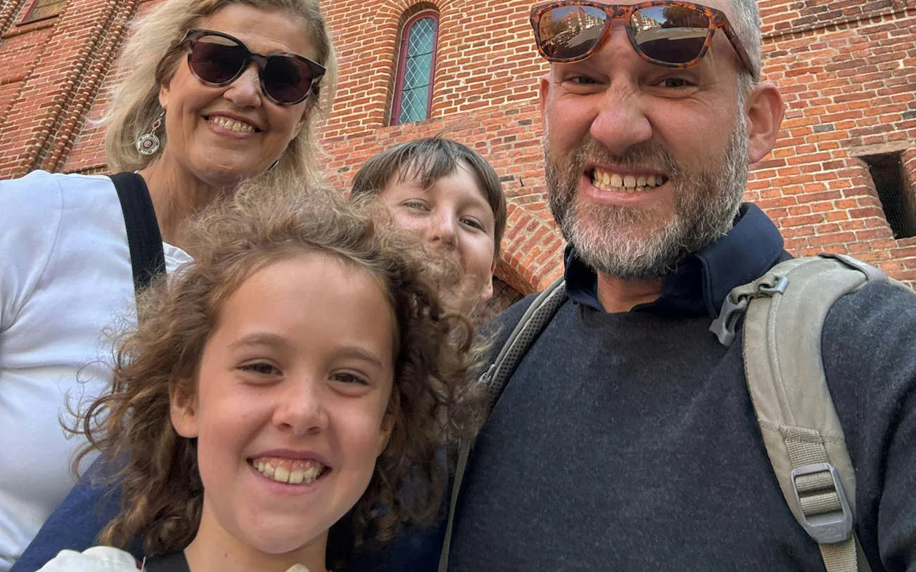 Family enjoying the Watchmaker's Curse city exploration game in Gdansk.
