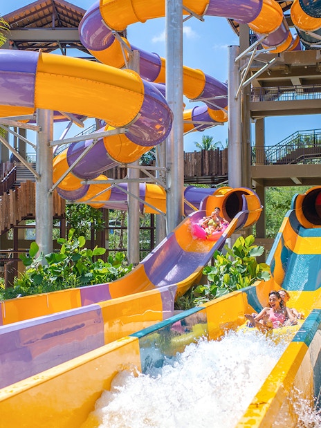 Water slide at Andamanda Phuket with people enjoying the ride.