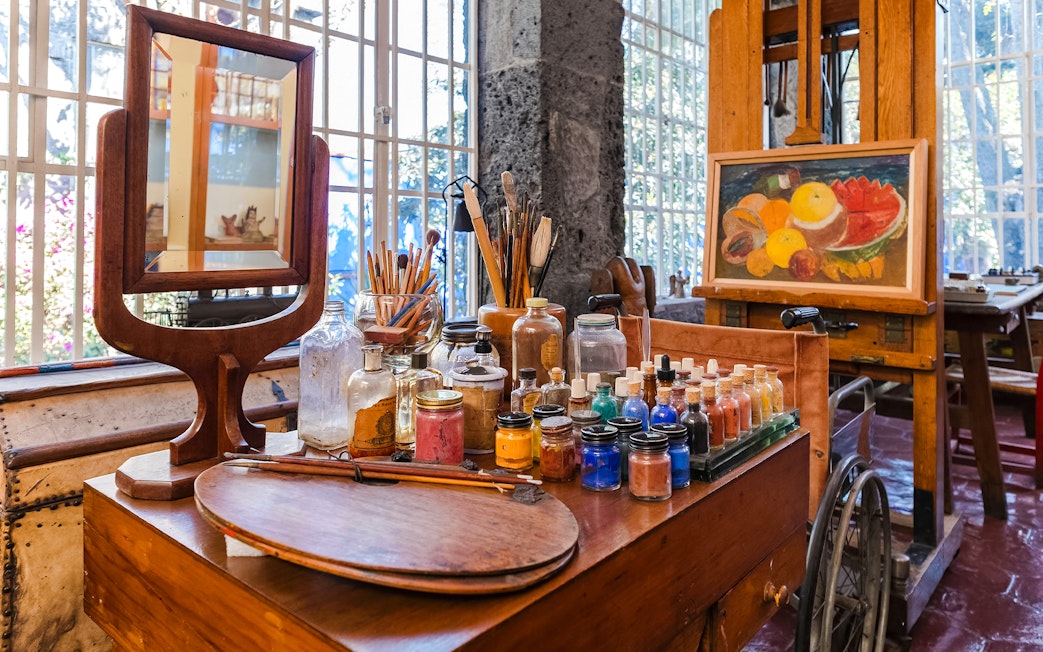 Art supplies and easel inside Frida Kahlo Museum, Mexico City.
