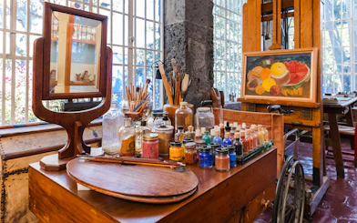 Art supplies and easel inside Frida Kahlo Museum, Mexico City.