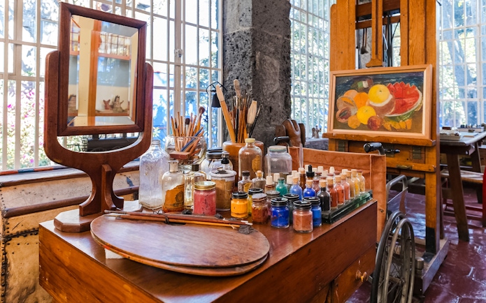 Art supplies and easel inside Frida Kahlo Museum, Mexico City.