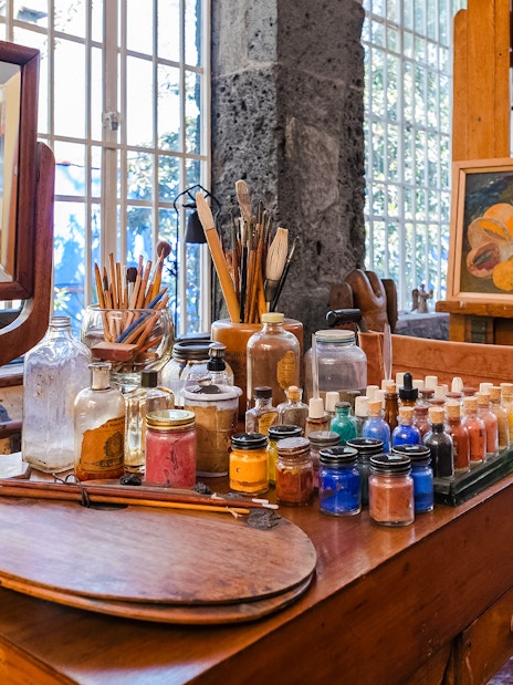 Art supplies and easel inside Frida Kahlo Museum, Mexico City.