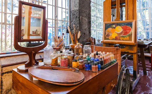 Art supplies and easel inside Frida Kahlo Museum, Mexico City.