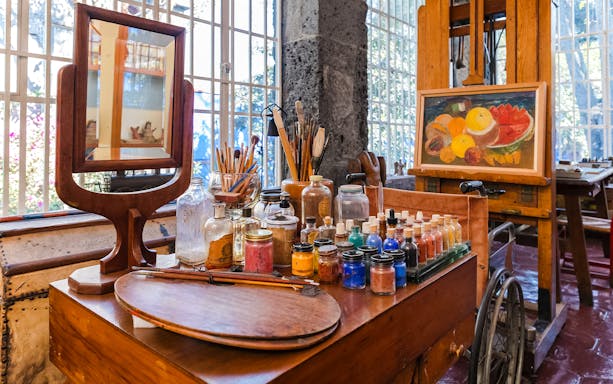Art supplies and easel inside Frida Kahlo Museum, Mexico City.