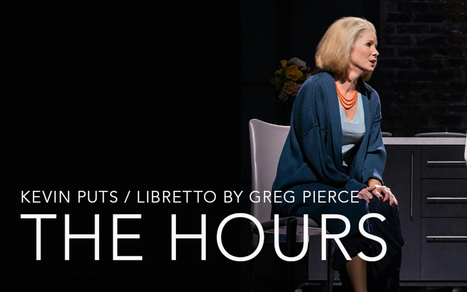 Opera scene from "The Hours" with a performer seated on stage.