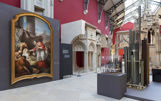 Notre-Dame de Paris exhibition at City of Architecture & Heritage, featuring a large painting and architectural models.