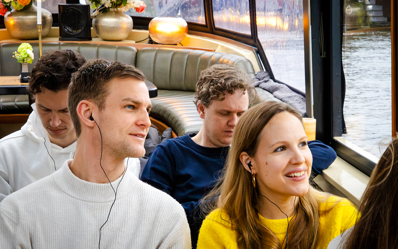Passengers enjoying the Amsterdam Historic Luxury VR boat tour.