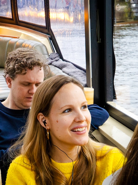 Passengers enjoying the Amsterdam Historic Luxury VR boat tour.