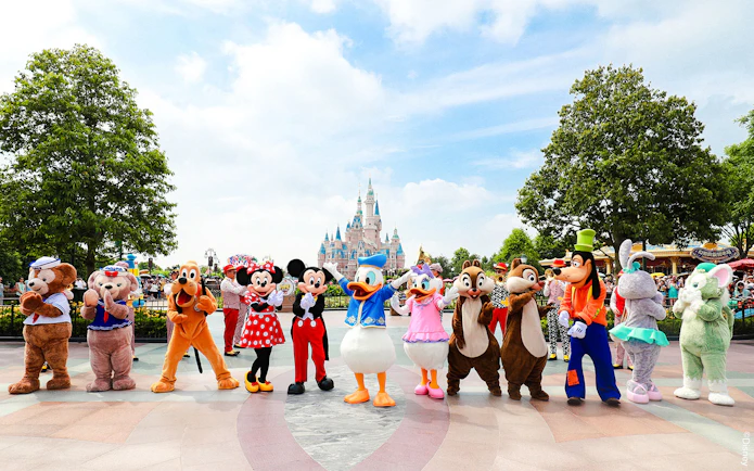 Characters in front of Enchanted Storybook Castle at Shanghai Disneyland.