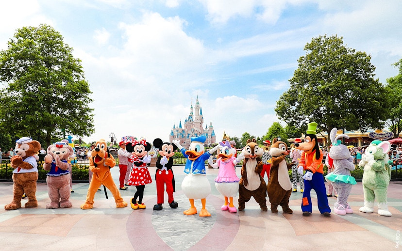 Characters in front of Enchanted Storybook Castle at Shanghai Disneyland.