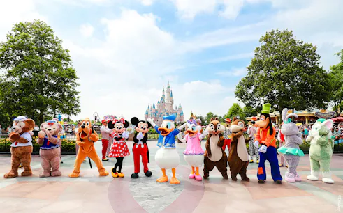 Characters in front of Enchanted Storybook Castle at Shanghai Disneyland.