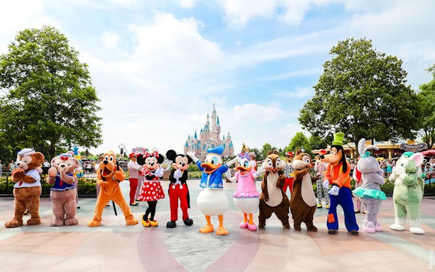 Characters in front of Enchanted Storybook Castle at Shanghai Disneyland.