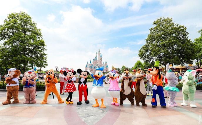 Characters in front of Enchanted Storybook Castle at Shanghai Disneyland.