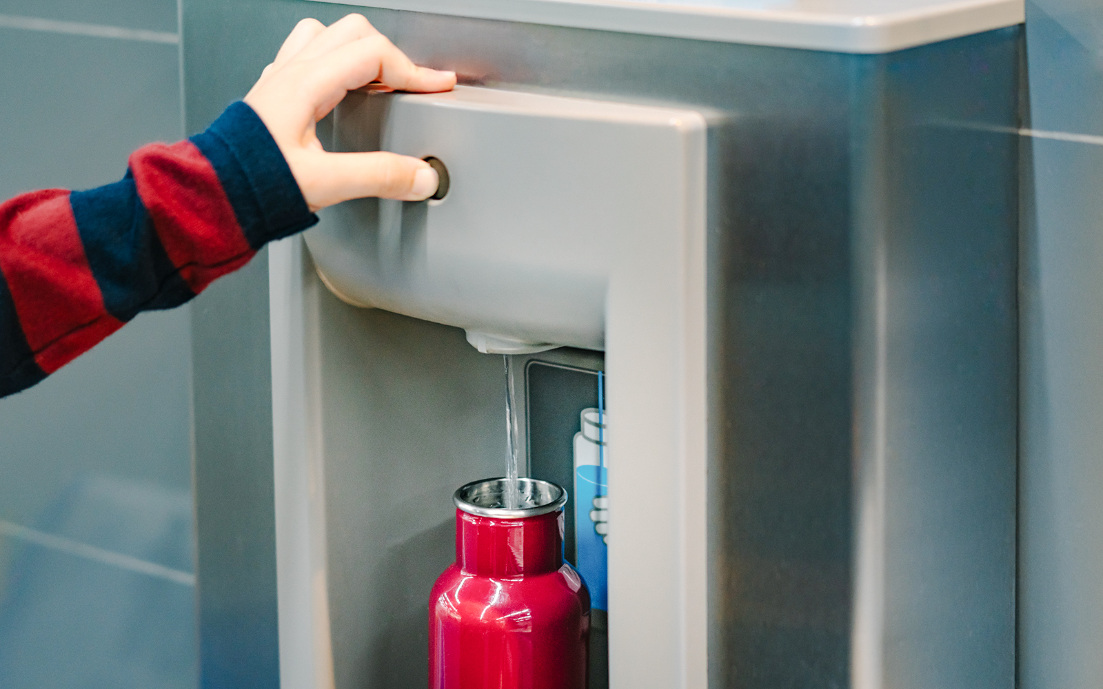 Filling a red bottle 