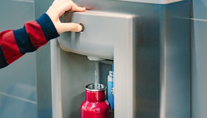 Filling a red bottle