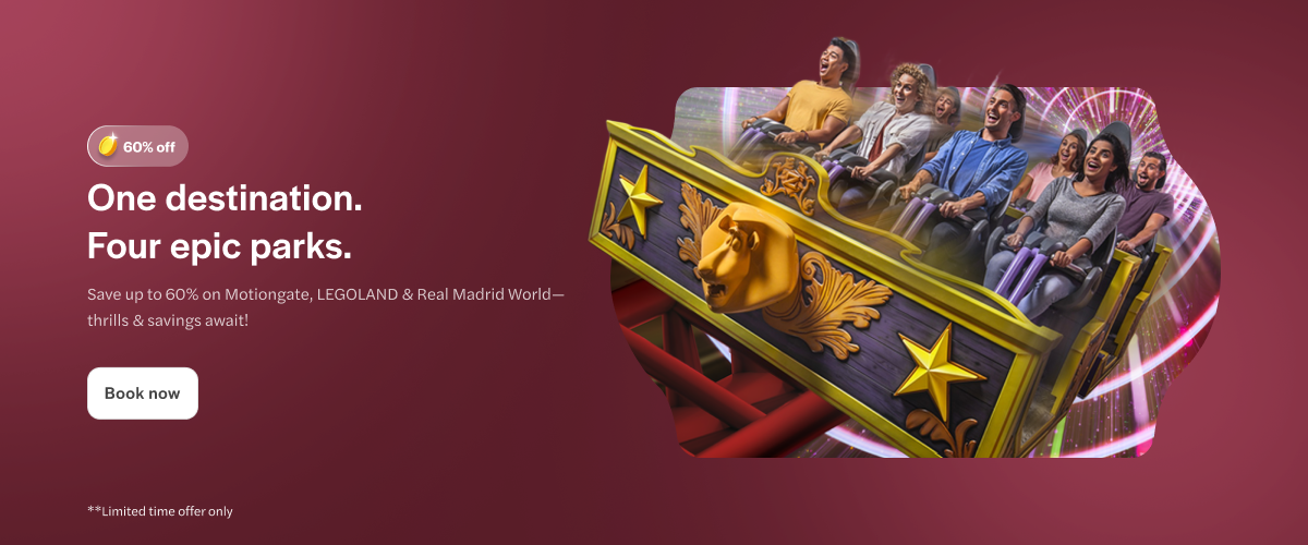 Roller coaster ride at Dubai Park & Resort with excited visitors.