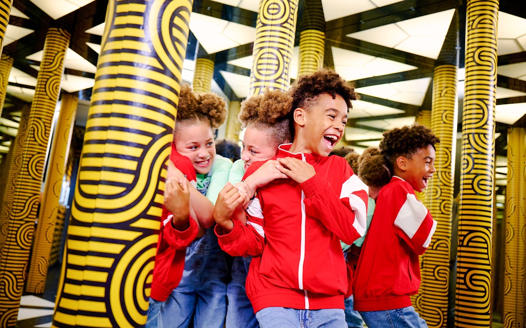 Guests enjoying mirror maze at Paradox Museum London.